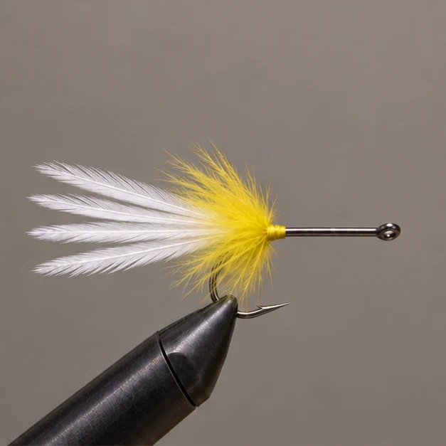 Yellow marabou surrounding the white feather tail base.