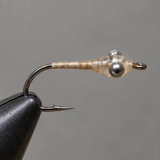 A small clear resin body encloses transverse bead-chain eyes.