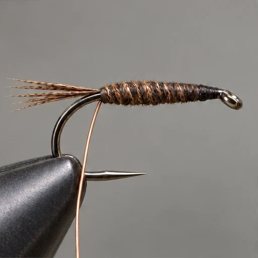 Pheasant Tail Nymph, step 3: Slim brown abdomen; copper still loose at rear.